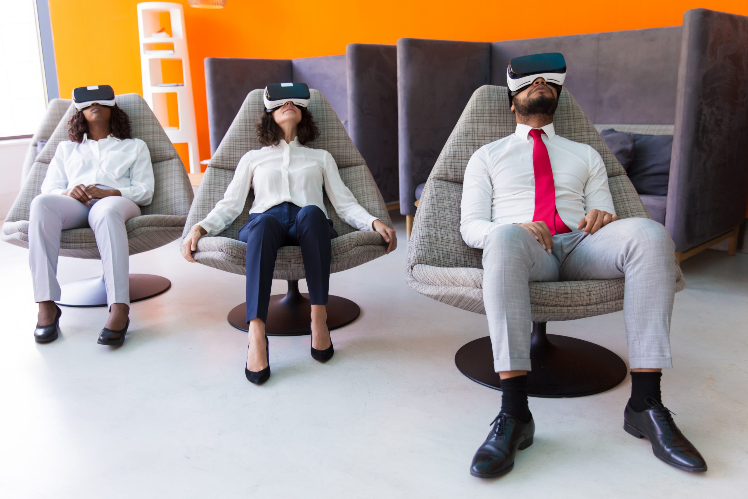 Peaceful business colleagues enjoying VR experience